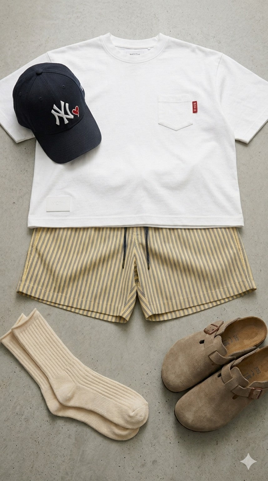 MOTH white pocket tee styled with striped shorts, a navy cap, cream socks and suede clogs